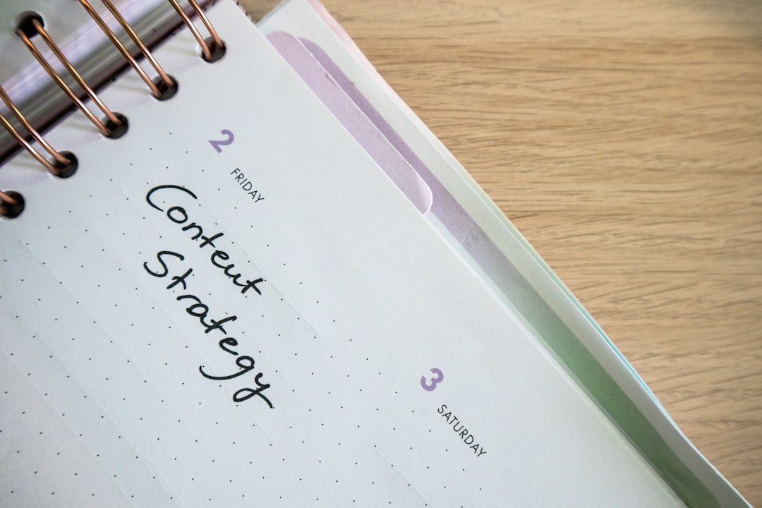 Desk with a planner with the words Content Strategy on it